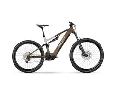 Ruskea ja musta Ghost E-ASX ABS 2026 sähkömaastopyörä, jossa on paksut renkaat, Bosch Performance Line CX -moottori ja levyjarrut. Rungossa näkyy SÄHKÖPYÖRÄT.NET-brändinimi. Pyörä on kuvattu kyljellään valkoista taustaa vasten.