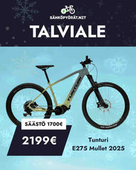 Tunturi vihreä maastopyörä talvisella taustalla